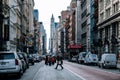 Early morning people crossing in the middle of  the street at Broadway in SOHO New York City Royalty Free Stock Photo