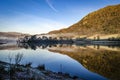 Early morning reflections on the lake showing the mist hovering over the water Royalty Free Stock Photo