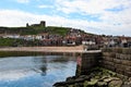 Early morning reflections on the northside of Whitby. Royalty Free Stock Photo