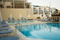 Early morning at the resort. The clear blue waters of the swimming pools await visitors Royalty Free Stock Photo