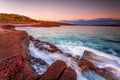 Early morning on the rich red rocky coast of Eden Royalty Free Stock Photo