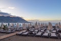 Early morning by the sea. A beach without people. Sun beds and sun umbrellas. Montenegro. Budva Royalty Free Stock Photo