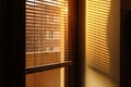 Early morning shining sun through window blinds