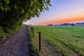 early morning with a sky full of beautiful colors during sunrise in the rolling hills landscape of Limburg Royalty Free Stock Photo