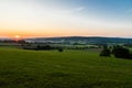 early morning with a sky full of beautiful colors during sunrise in the rolling hills landscape of Limburg Royalty Free Stock Photo