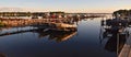 Early morning sun rays on a marina, boats, docks