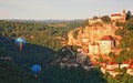 Balloons rise in the valley at Rocamadour, Lot, France Royalty Free Stock Photo