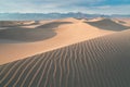 Early Morning Sunlight Over Sand Dunes And Mountains At Mesquite flat dunes, Death Valley National Park, California USA Royalty Free Stock Photo