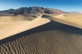 Early Morning Sunlight Over Sand Dunes And Mountains At Mesquite flat dunes, Death Valley National Park, California USA Royalty Free Stock Photo