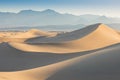 Early Morning Sunlight Over Sand Dunes And Mountains At Mesquite flat dunes, Death Valley National Park, California USA Royalty Free Stock Photo