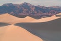 Early Morning Sunlight Over Sand Dunes And Mountains At Mesquite flat dunes, Death Valley National Park, California USA Royalty Free Stock Photo