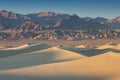 Early Morning Sunlight Over Sand Dunes And Mountains At Mesquite flat dunes, Death Valley National Park, California USA Stovepipe Royalty Free Stock Photo