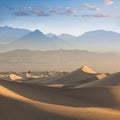 Early Morning Sunlight Over Sand Dunes And Mountains At Mesquite flat dunes, Death Valley National Park, California USA Stovepipe Royalty Free Stock Photo