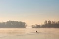 Early morning sunrise, boating on the lake in a huge fog Royalty Free Stock Photo