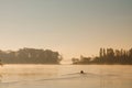 Early morning sunrise, boating on the lake in a huge fog Royalty Free Stock Photo