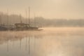 Early morning sunrise, boating on the lake in a huge fog Royalty Free Stock Photo