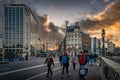 Early morning, sunrise, on busy OConnell Bridge with Luas and bus, Dublin, Ireland Royalty Free Stock Photo