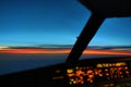 Early morning sunrise - captains view in the flight deck of a modern airliner airplane Royalty Free Stock Photo