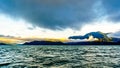 Early Morning Sunrise and Dark Clouds over Harrison Lake Royalty Free Stock Photo