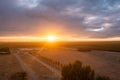 Early morning sunrise agriculture field and farmland in California.