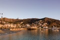 Early morning sunrise seascape in Avalon Harbor looking toward the beach and small town