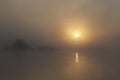 Early morning sunrise. Very dense fog over the river. Abstraction