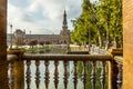 An early morning view along a canal in the Plaza de Espana in Seville, Spain Royalty Free Stock Photo