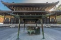 Early morning view of Jokoro (Incense Burner) in front of Hatto (Ceremony Hall) and sun flare at Zuiryusan Nanzen-ji or Zenrin-ji. Royalty Free Stock Photo