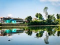 Early Morning View of Urban settelment nearby water reservoir with the reflection