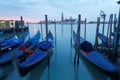 Early morning view of Venice with San Giorgio Maggiore Church in the background and gondolas parking in the Grand Canal Royalty Free Stock Photo