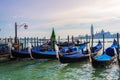 Early morning view of Venice waterfront with gondolas mooring Italy Royalty Free Stock Photo