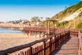 Early morning walk on Gonubie boardwalk next to the ocean at low tide Royalty Free Stock Photo