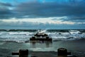 Early Morning Waves on Drainage Pipe on Beach