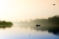 Early morning at yamuna ghat with golden sun, fog and blue water