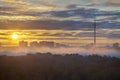 Early morning yellow city sunrise and fog