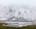 Frozen mountain lakes and mist in Andorra