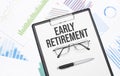 EARLY RETIREMENT sign. Conceptual background with chart ,papers, pen and glasses Royalty Free Stock Photo