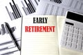 EARLY RETIREMENT text written on a notebook on chart and diagram Royalty Free Stock Photo