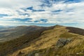 Early spring Carpathian mountain highland ridge picturesque landscape view in Eastern Europe moody weather time cloudy blue sky Royalty Free Stock Photo