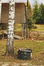 early spring cleaning in garden. Raking leaves. Royalty Free Stock Photo