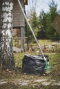 early spring cleaning in garden. Raking leaves. Royalty Free Stock Photo