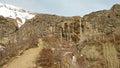 The early spring landscape of rocks in Alborz mountains and Sangan Waterfall Royalty Free Stock Photo