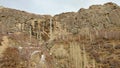 The early spring landscape of rocks in Alborz mountains and Sangan Waterfall Royalty Free Stock Photo