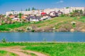 Early spring landscape, in the Rostov region in the city of Shakhty, on the Grushevka river. Sunny sunset in yellow and orange war Royalty Free Stock Photo