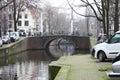 Early spring scene in Amsterdam city. Tours by boat on the famous Dutch canals. Cityscape with canal houses in Holland, Royalty Free Stock Photo