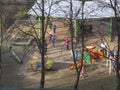Early spring. The sun is shining. Children play in the yard. Kindergarten