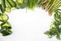 Spring veggies, isolated. Green seasonal vegetables on a white background, top view. Frame with a copy space.