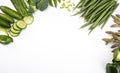 Early, spring veggies, isolated. Green seasonal vegetables on a white background, top view. Frame with a copy space.