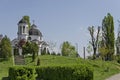 Early springtime green, bell tower and church with modern architecture in district Drujba Royalty Free Stock Photo