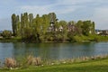 Early springtime green, lake, bell tower and church with modern architecture in district Drujba Royalty Free Stock Photo